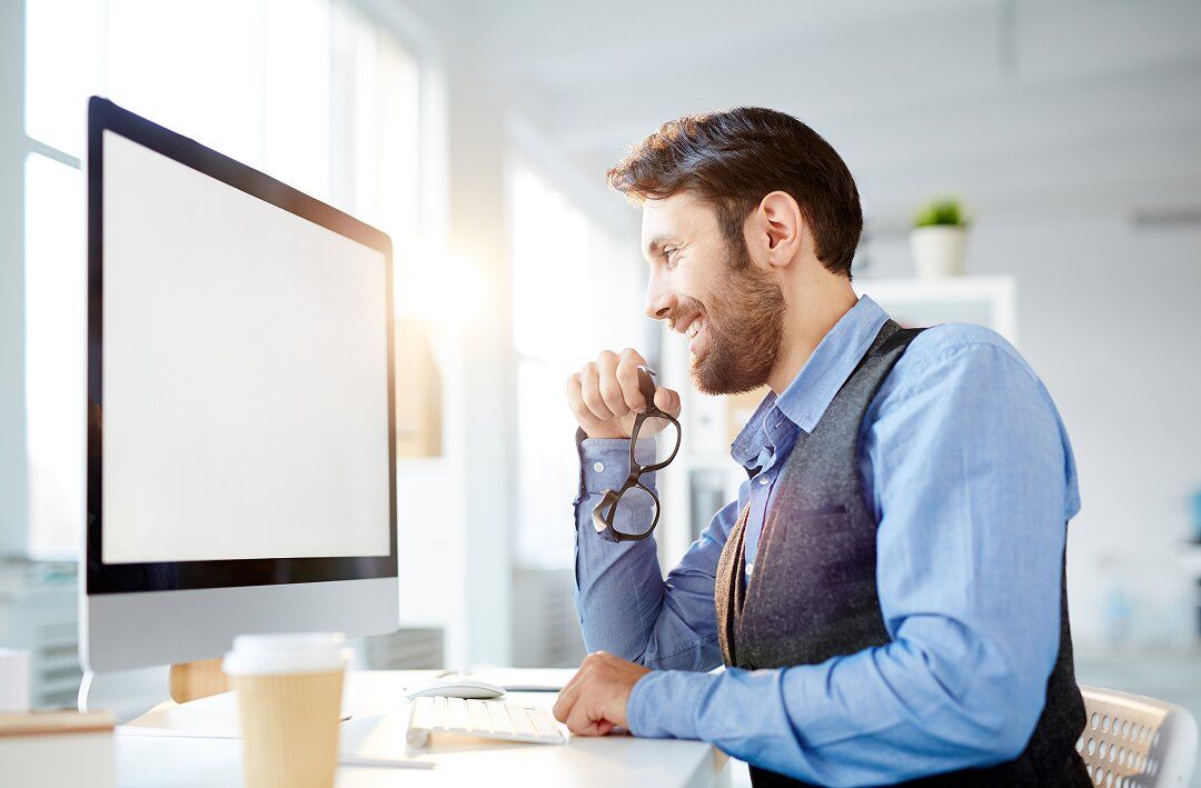 Accountant reviewing client financials at his desk